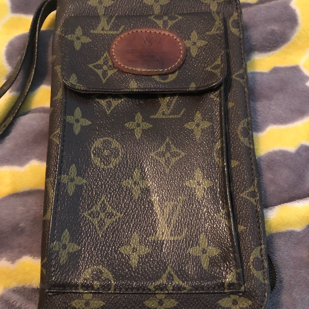 LV clutch with cell phone compartment.Mild patina